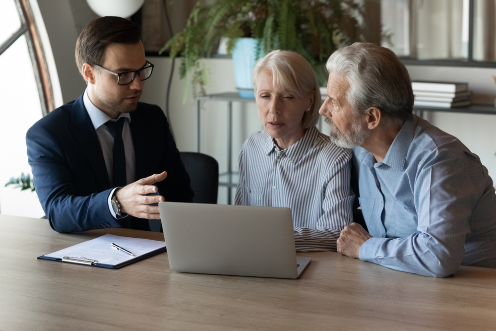 Couple in a meeting with a solicitor.