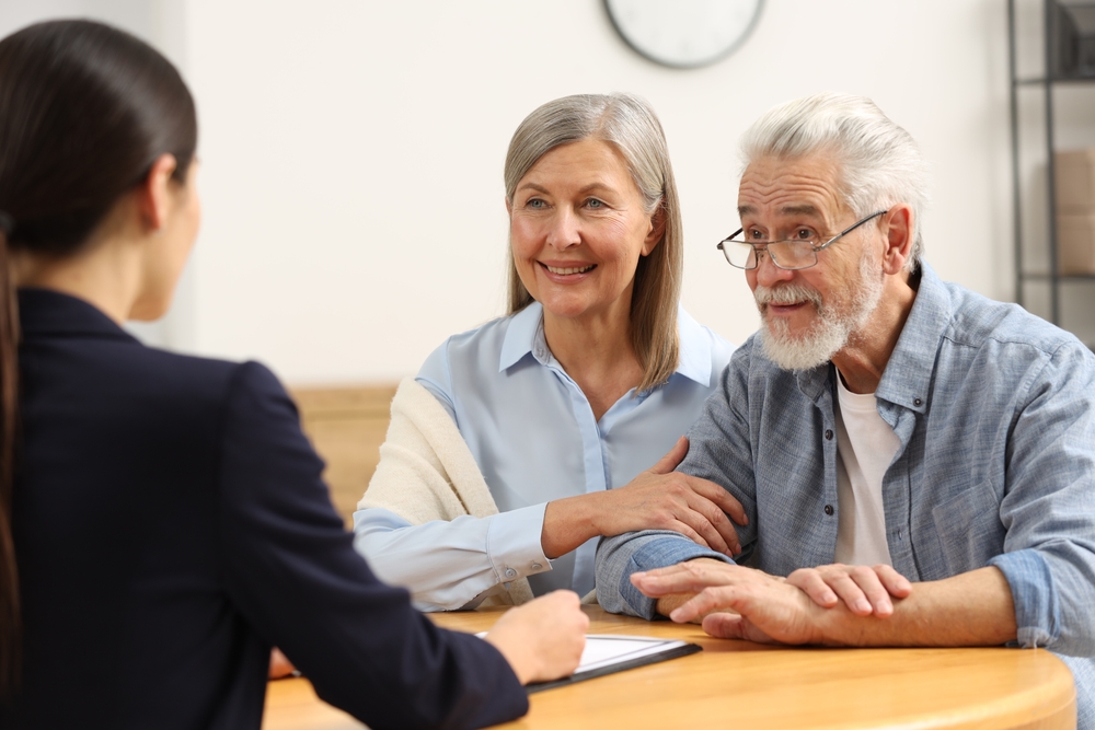 Couple in a meeting with a solicitor.